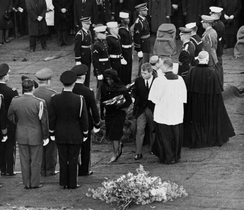 Jacqueline Kennedy and Attorney General Robert F. Kennedy walk away from President Kennedy's casket during interment at Arlington National Cemetery on November 25, 1963.